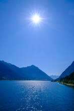 Austria, Tyrol, Pertisau, Summer Sun Shining Over Achensee Lake