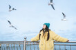 © Westend61 - Woman with eyes closed near railing