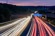 © Westend61 - Germany, Baden-Wurttemberg, Leonberg, Vehicle light trails stretching alongBundesautobahn8 at dusk