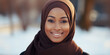 Portrait of a beautiful young African woman with brown hijab.