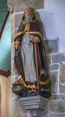 Wall Mural - Statue de Saint Hervé dans l'église de l'enclos paroissial de Guimilliau, Bretagne, France