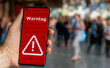 © Fokussiert - An alert on a mobile phone during the national warning day in Germany. The text 'Warntag' (warning day) appears on the display.