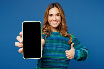 young woman she wears knitted sweater casual clothes hold in hand use mobile cell phone with blank s