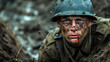 Muddy soldier with determined gaze lying in wait, battle-weary but alert in trenches