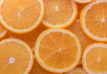 oranges cut into slices and laid out on the table as a food background 2