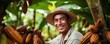 portrait of a cocoa farmer harvesting cocoa
