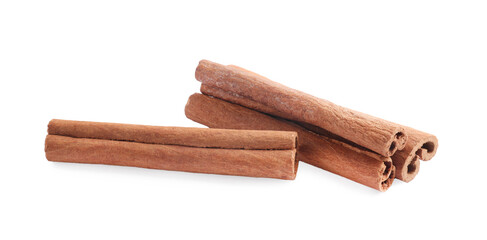 Pile of aromatic cinnamon sticks isolated on white