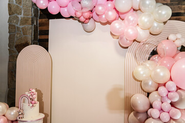 Wall Mural - Delicious reception at a birthday party. Arch decorated with pink, and brown balloons, decor rainbow. Trendy baptism cake for girl. Photo wall decoration space or place for text. Celebration concept.