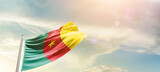 Fototapeta  - Cameroon national flag cloth fabric waving on the sky - Image