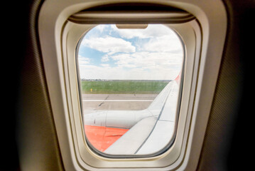 Wall Mural - view from the airplane window of the airport during takeoff