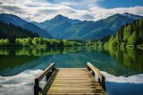 Fototapeta  - Serene lake view with wooden dock and mountain backdrop