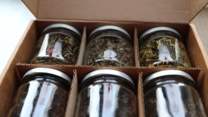 Poster - Glass jars with different types of tea. tea ceremony.