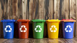Multicolored Recycle Bins with Symbols on Wooden Background for Eco Recycling