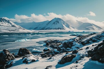 Poster - A picturesque view of a mountain range with a serene body of water in the foreground. Perfect for travel brochures or nature-themed designs