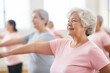 © SnapVault - An active group of elderly people enjoy participating together in an indoor gymnastics class to improve their physical condition, well-being, and socialize with each other.Active aging concept