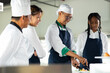 © NVB Stocker - Group of student teen girl learning. Cooking class. culinary classroom. group of happy young woman multi - ethnic students are focusing on cooking lessons in a cooking school.