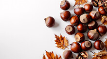 Autumn Composition With Chestnuts And Leaves On White Background. Flat Lay, Top View, Copy Space