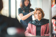 © chokniti - Asian Hairdresser giving treatment and barber occupation service, Professional hairstylist combing and using scissors cut woman's hair to young beautiful customer girl in beauty salon