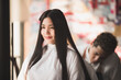 © chokniti - Asian Hairdresser giving treatment and barber occupation service, Professional hairstylist combing and using scissors cut woman's hair to young beautiful customer girl in beauty salon