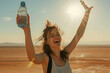 The girl is happy that she found a bottle of water in the middle of the desert
