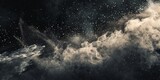 Fototapeta Kosmos - Organic dust particles drift in the atmosphere against a dark backdrop.