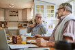 © Marko Geber - Happy senior couple eating breakfast in kitchen