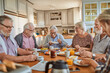 © Marko Geber - Happy senior people eating breakfast at home