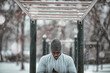 © Marko Geber - Young man exercising outdoors in winter snow