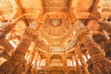 Wall Mural - Bas-relief at columns at famous ancient Ranakpur Jain temple in Rajasthan state, India