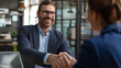 © JW Studio - Close up of handshake in the office, Smiling successful business people shaking hands during meeting.