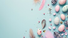 Whimsical Easter Egg And Feather Arrangement On A Soft Blue Background