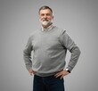 © opolja - Portrait of happy casual mature man smiling, senior age man with gray hair, Isolated on gray background