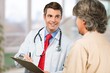 © BillionPhotos.com - Smile doctor consulting patient in hospital for support.