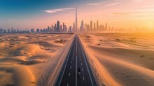 View From Above, Stunning Aerial View Of An Unidentified Person Walking On A Deserted Road Covered By Sand Dunes With The Dubai Skyline In The Background. Dubai, United Arab Emirates