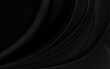 © Kamjana - Black gray satin dark fabric texture luxurious shiny that is abstract silk cloth background with patterns soft waves blur beautiful.