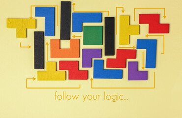 Colorful blocks on yellow background. Logic concept