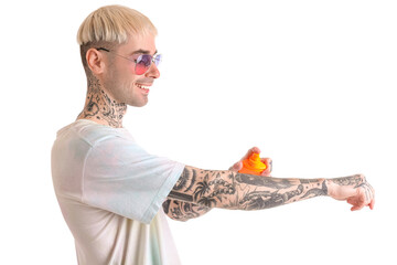 Wall Mural - Tattooed man applying sunscreen cream against white background