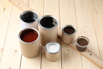 Poster - Cans with different wood stains and varnish on wooden surface