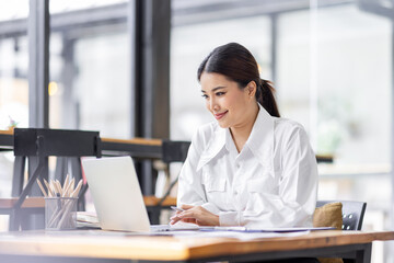 Sticker - Asian Business woman work in the office. concept of tax, report, accounting, statistics, and analytical research.