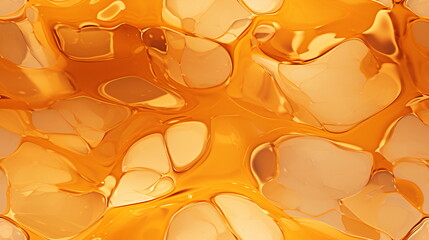 Close-up of a transparent liquid surface with an orange honey, jelly texture. An abstract background with an organic feel featuring irregularly shaped clusters of golden liquid masses.