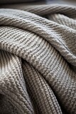 Fototapeta Maki - Minimalist close up of a knit throw blanket AI generated