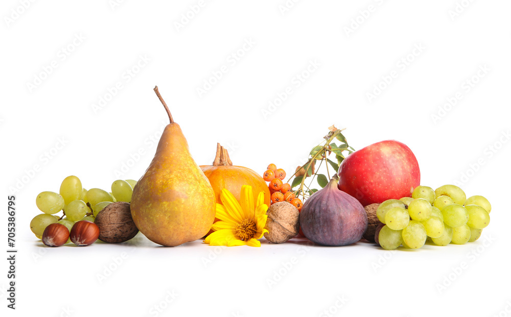 Different fresh fruits, nuts and berries on white background