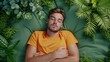 Relaxed man laying down on green background. Top view portrait of young man enjoy his freedom with nature, Natural alternative therapy