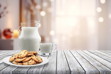 Sticker - Plate with tasty sweet cookies and milk on table