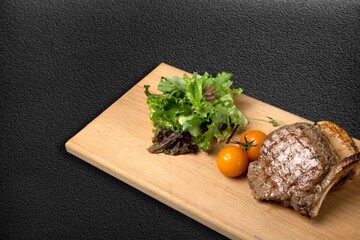 Wall Mural - Grilled beef steak with vegetables on the desk