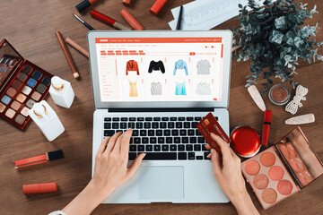 Woman shopping online on internet marketplace browsing for sale items for modern lifestyle and use credit card for online payment from wallet protected by utmost cyber security software