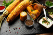 Grilled corn on the cob on kitchen table flat lay healthy food background