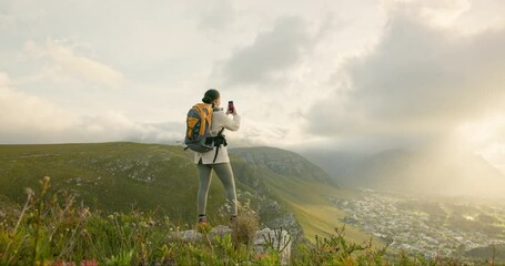 Wall Mural - woman, trekking and video recording on mountains in adventure, wellness and health with nature and c