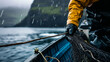Close up of a Fisherman in rough weather handling nets on his boat. Concept of industrial fishing. Shallow field of view.
