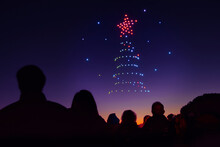 Christmas Tree Drawn With Drone Lights In The Night Sky Of Arroyomolinos, Madrid (Spain).